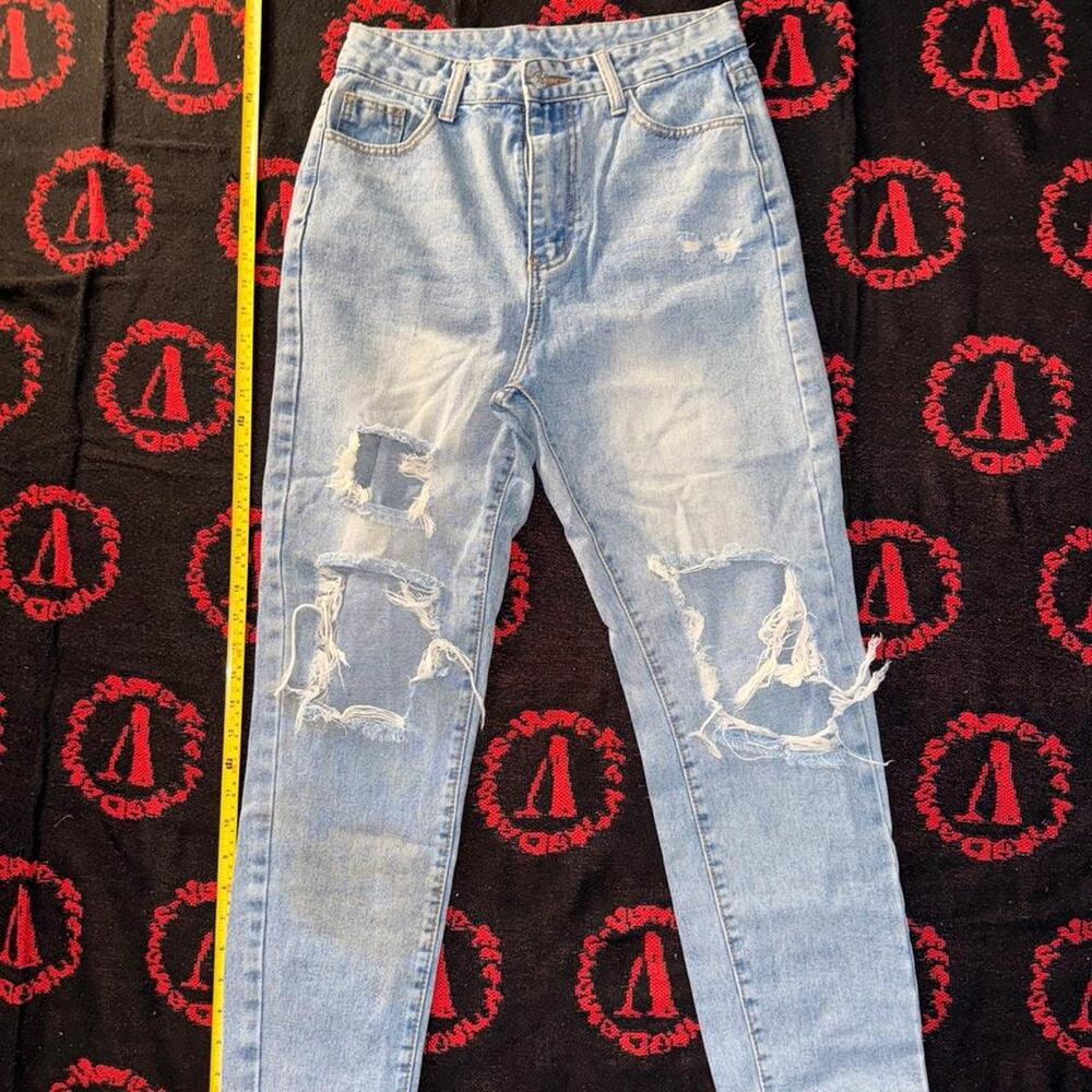 Light wash distressed denim jeans